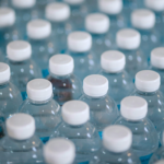 Close-up of plastic water bottles, representing bottled water consumption, plastic waste and environmental impact.